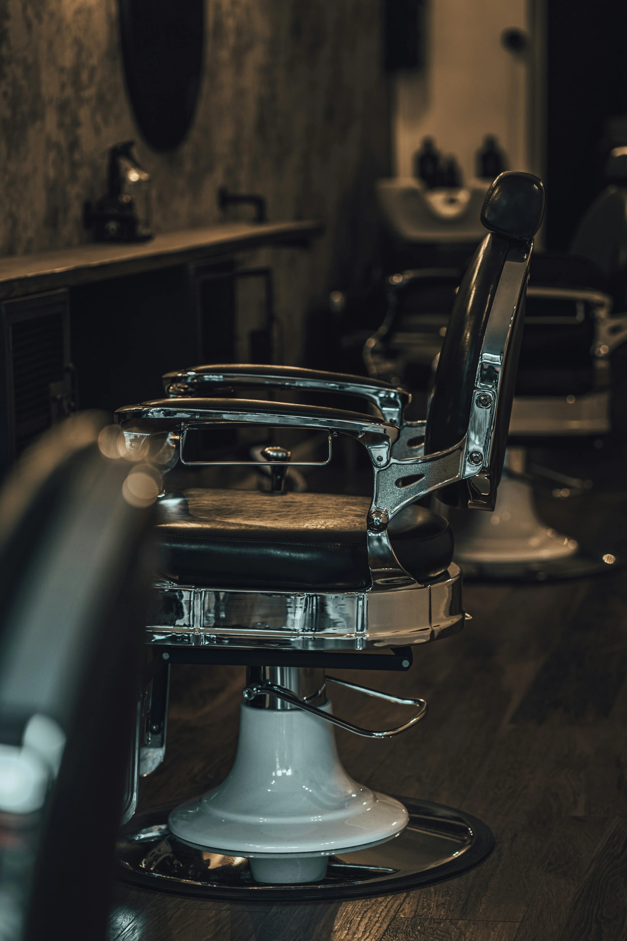 Grooming chairs and mirrors in a warmly lit interior.